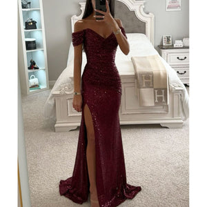 Robe longue de soirée fendue à paillettes et col dénudé