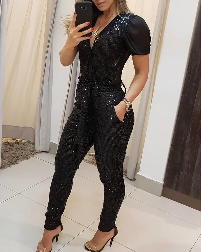 Combinaison pantalon à paillettes décolletée en V