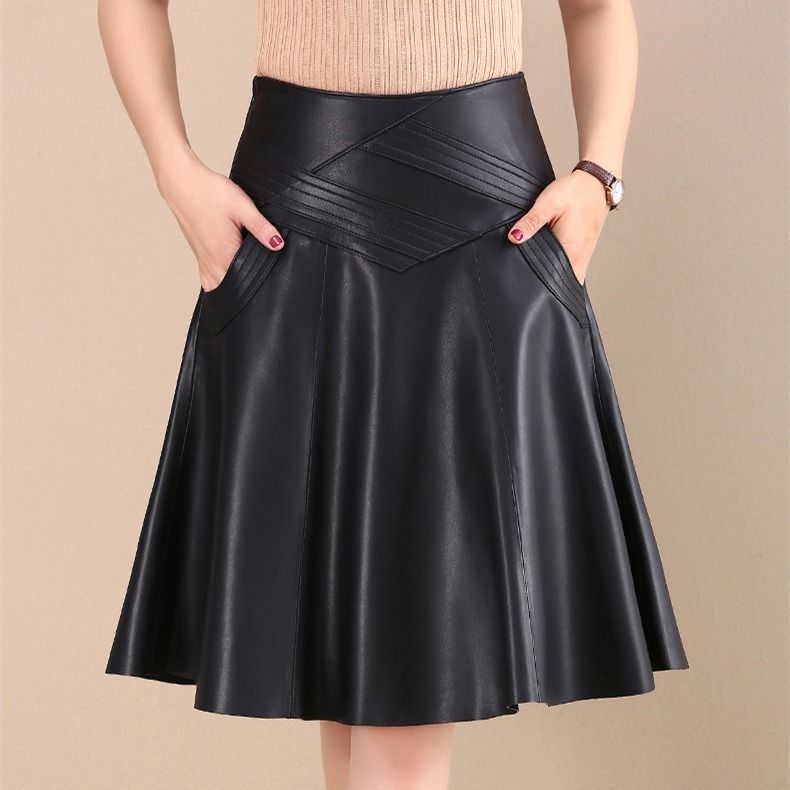 Jupe mi-longue en cuir plissé taille haute