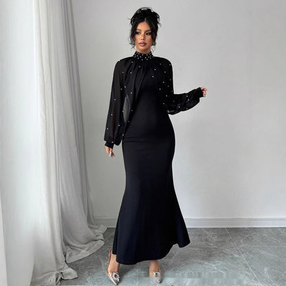 Robe longue moulante à manches bouffantes en dentelle