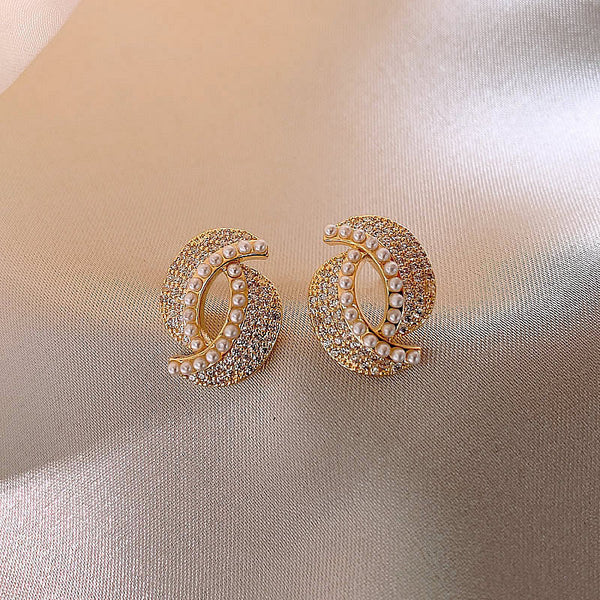 Boucles d'oreilles ornées de strass et de perle